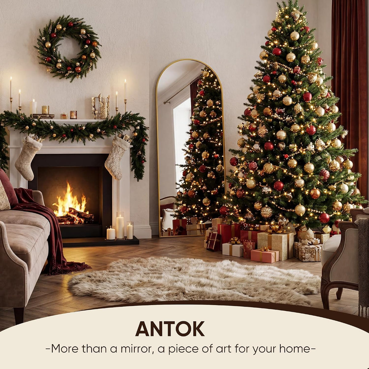 Gold arched full-length mirror beside a decorated Christmas tree and fireplace in a cozy living room.