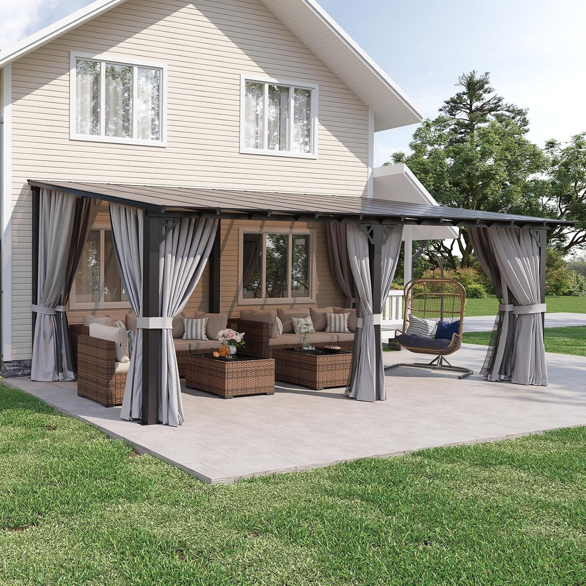 Wide daytime shot of the house with a long attached pergola, tied curtains and outdoor sofas and a hanging chair.