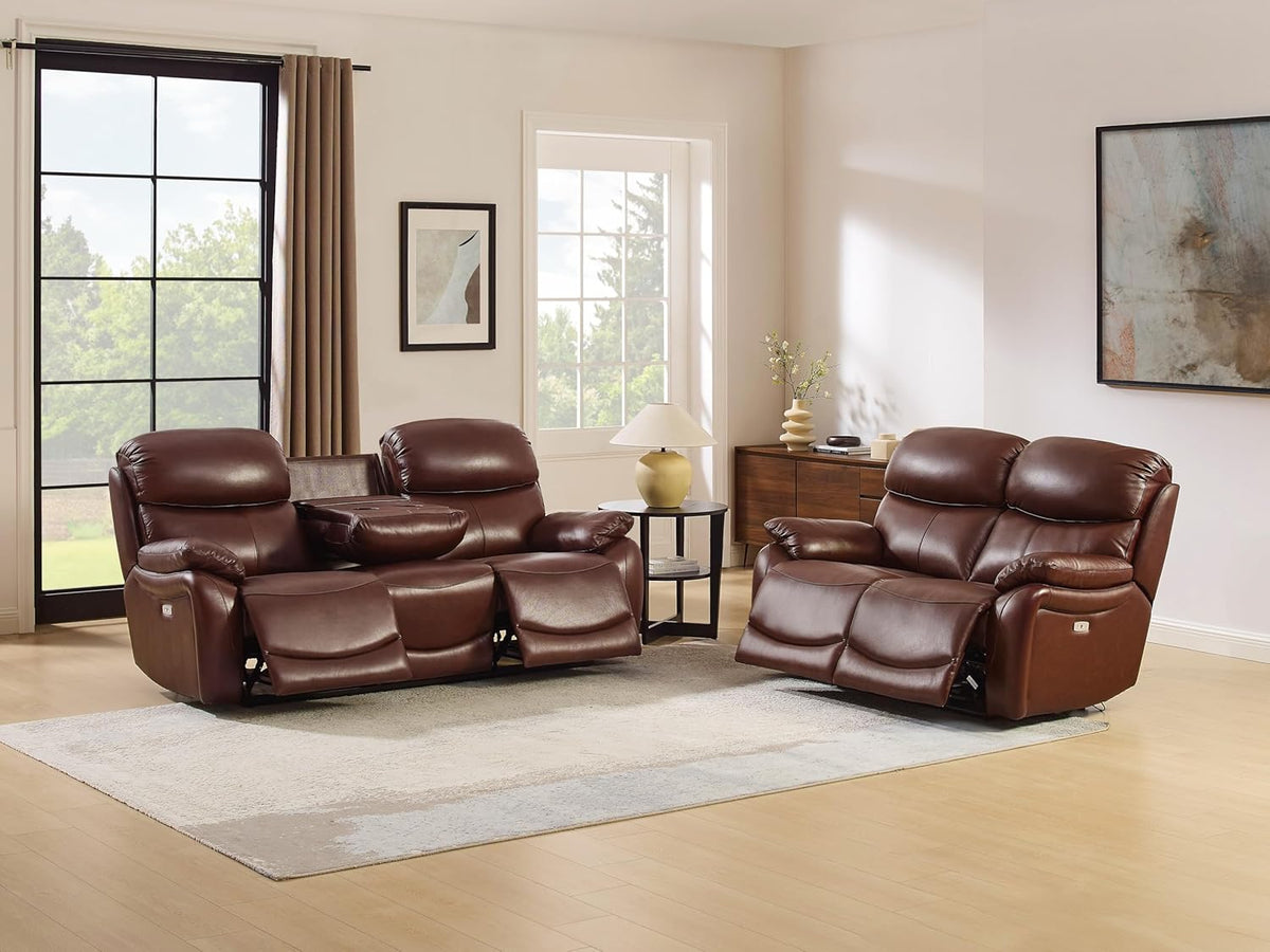Brown leather power reclining sofa with center drop-down table and matching reclining loveseat in a staged family room.