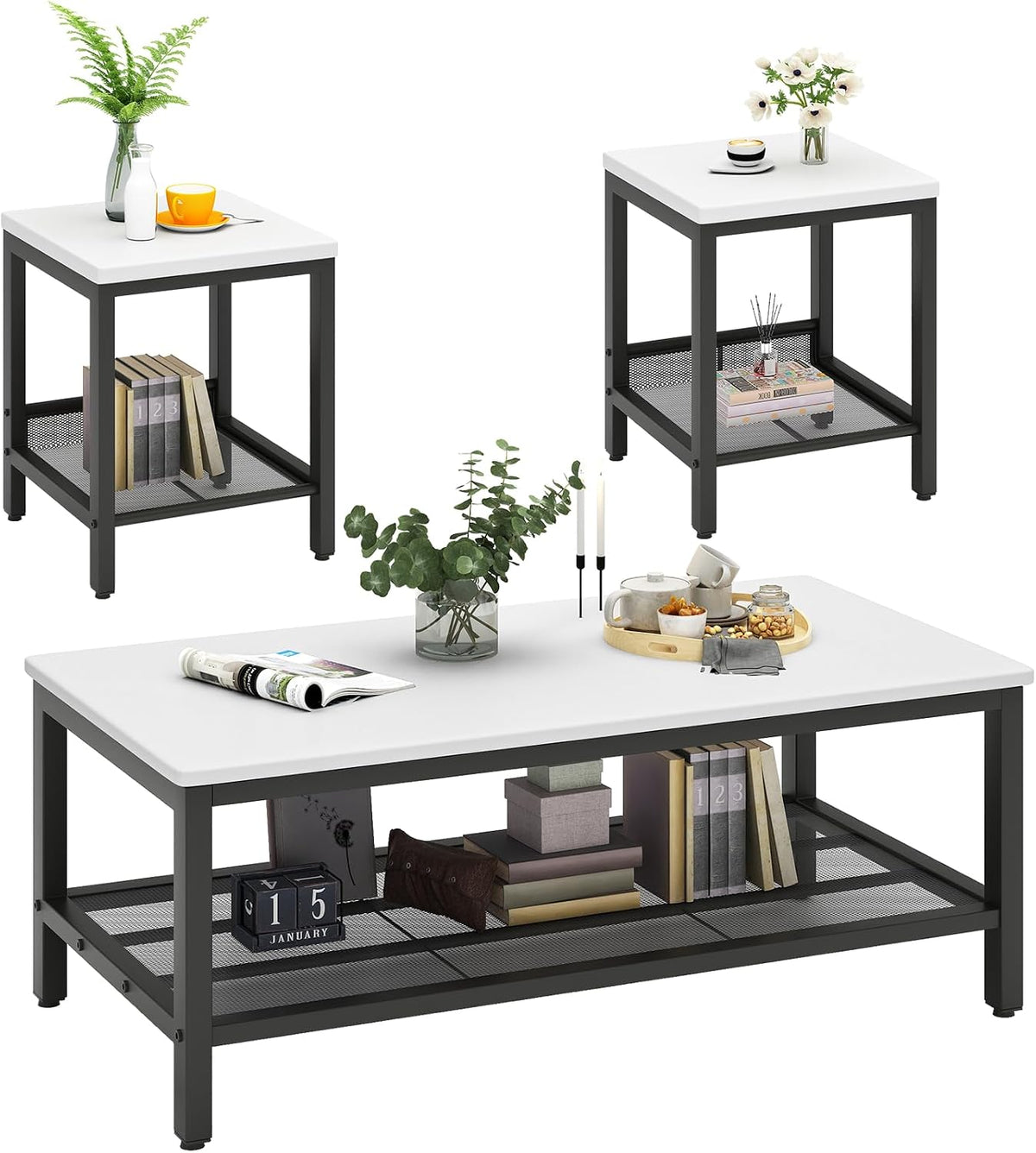 Three-piece table set with white tops and dark metal frames, shown from a high angle with tabletop decor.