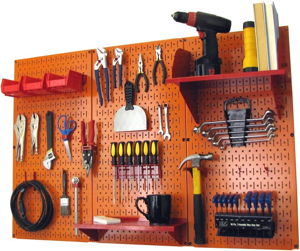 Orange pegboard with red shelf and bins, showing arranged pliers, screwdrivers, hammer and other tools.