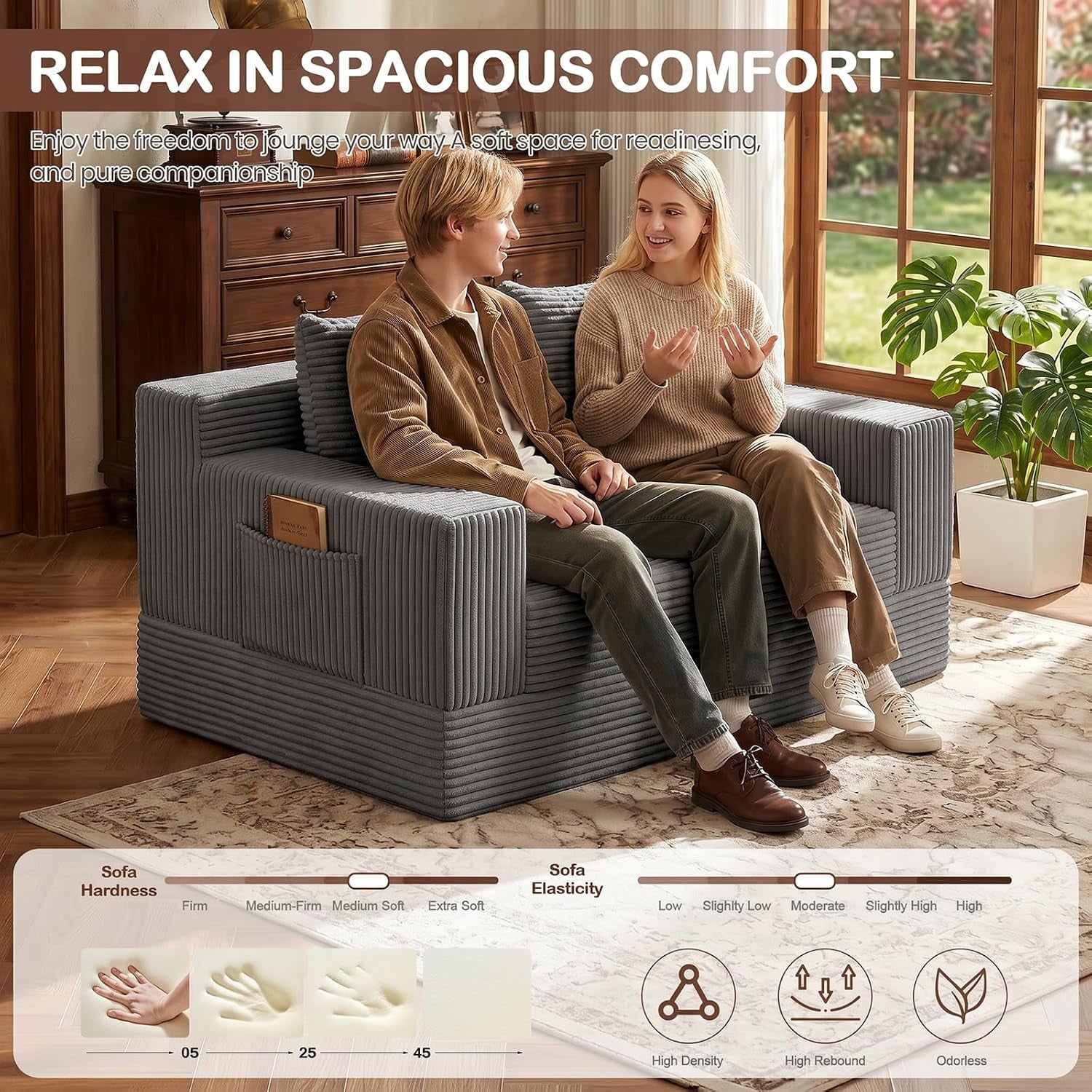 Couple seated on the grey corduroy loveseat in a bright room demonstrating spacious two-person seating