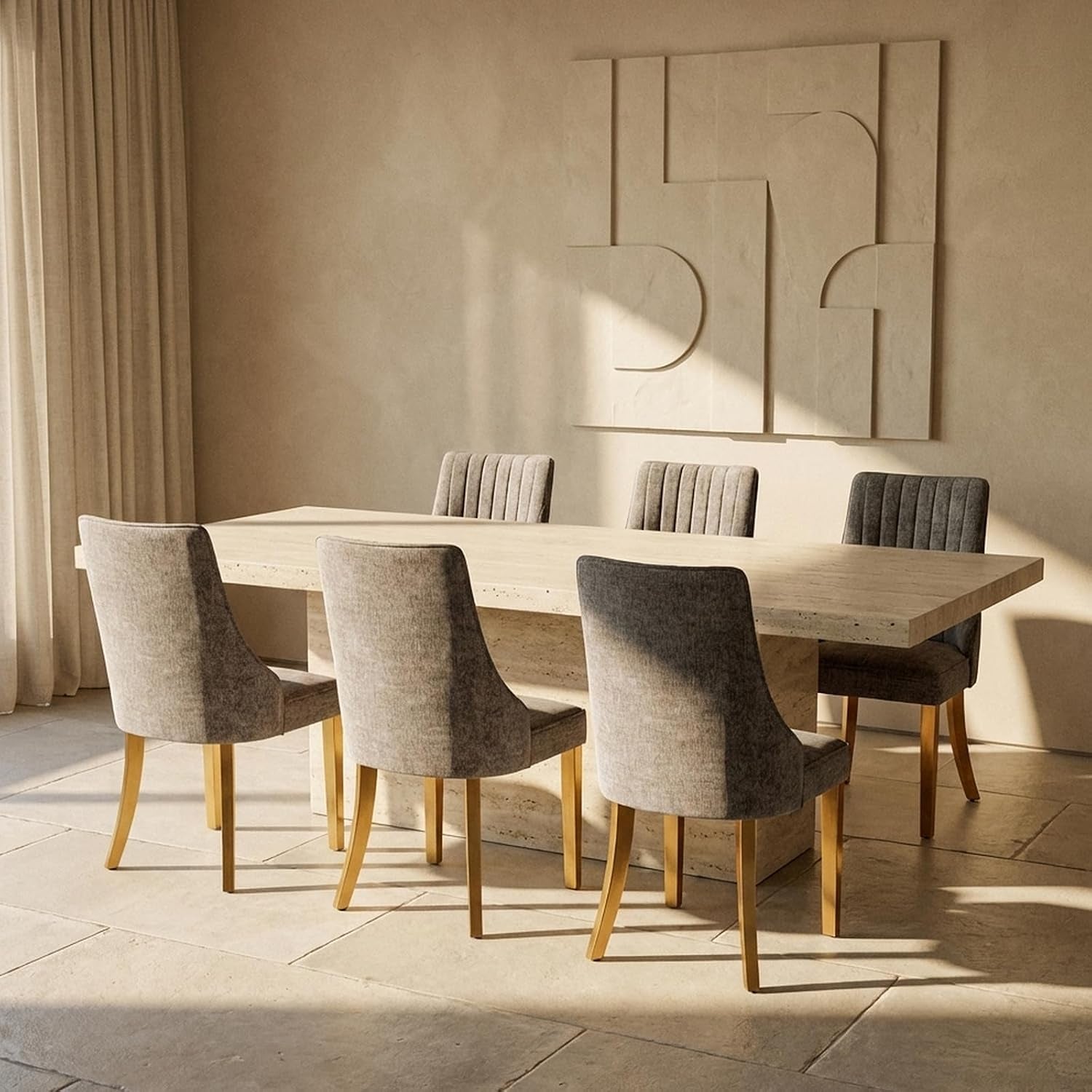 Six gray-beige chairs with gold legs positioned around a large light stone dining table