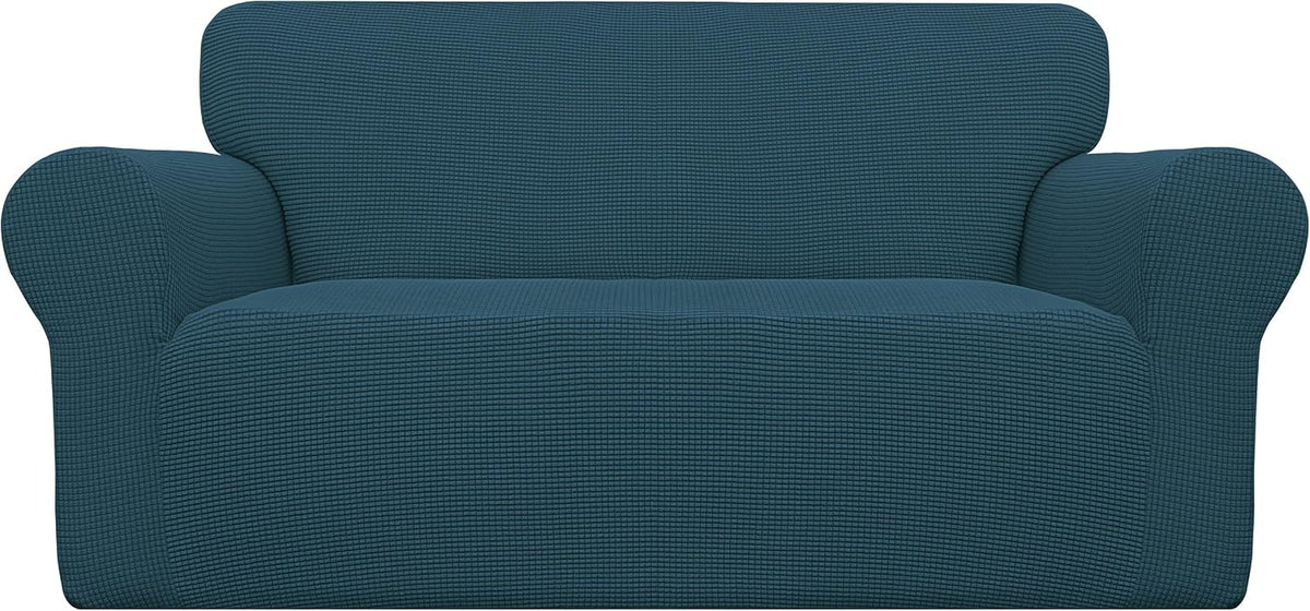 Front-facing loveseat with a teal textured stretch slipcover shown against a white background