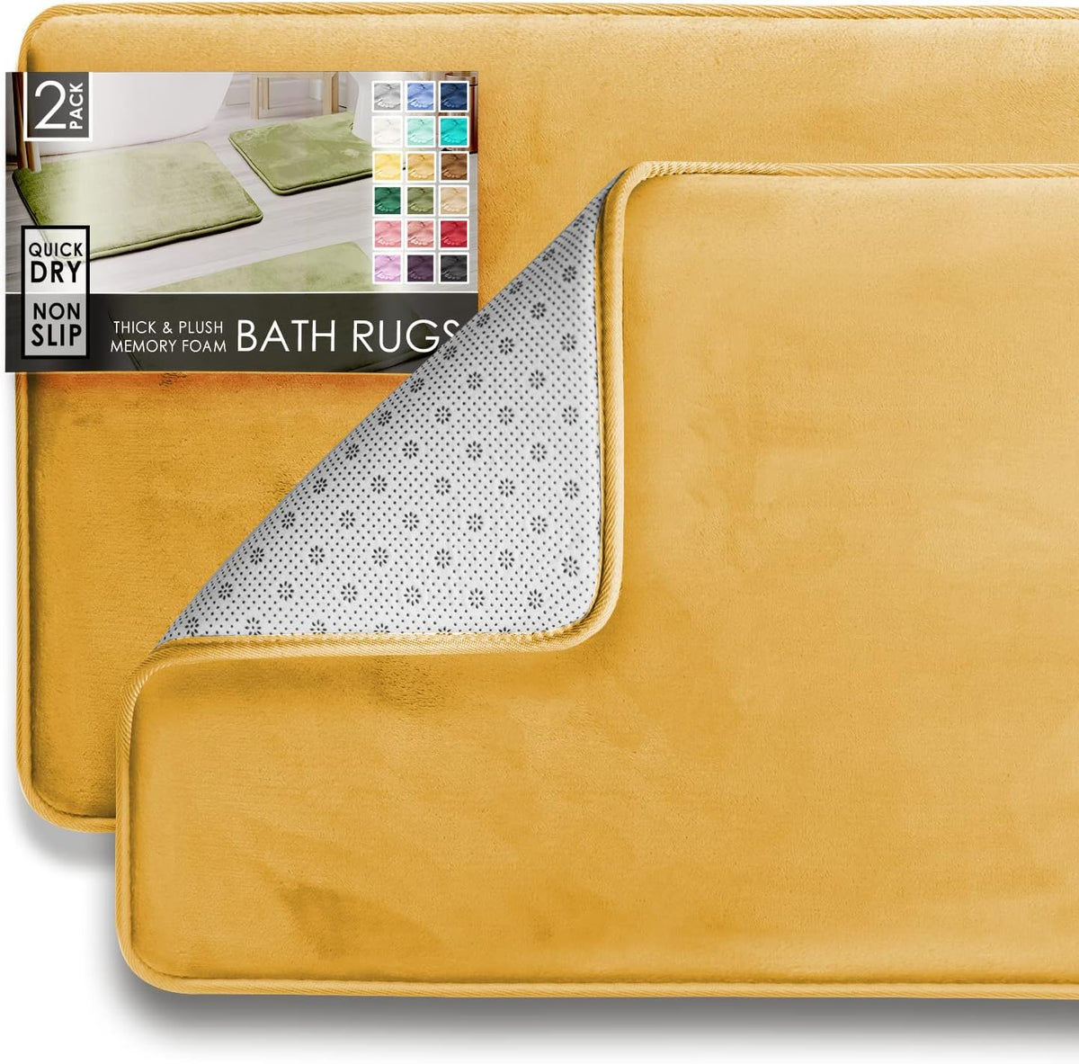 Close crop of two stacked golden-yellow rectangular bath mats with one corner peeled to show dotted non-slip underside.