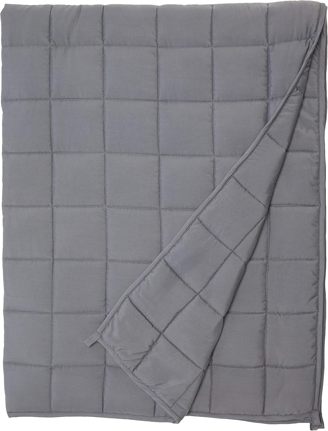 Dark grey weighted blanket spread flat showing square quilted pockets and folded corner