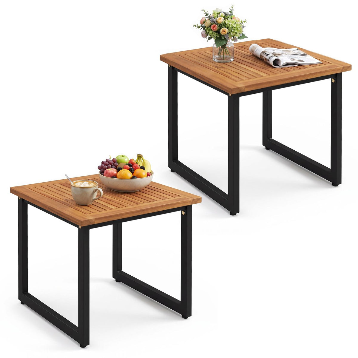 Two matching slatted side tables with black frames, styled with flowers, a drink, fruit and a magazine.