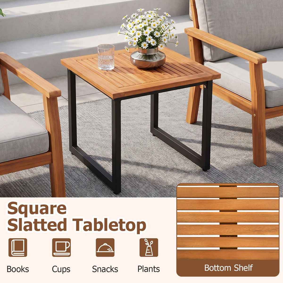 Square slatted wood table with black metal legs between two cushioned patio chairs
