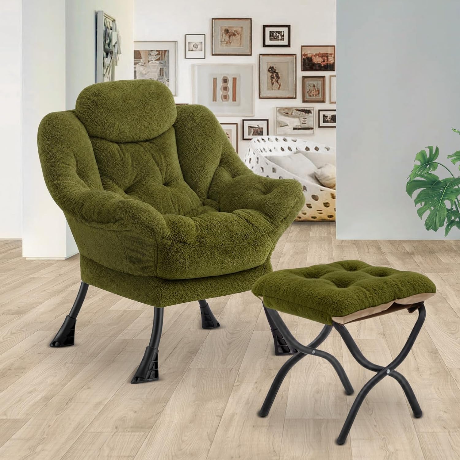 Olive-green plush armchair and ottoman placed on wood floor in a bright living area with framed wall art.