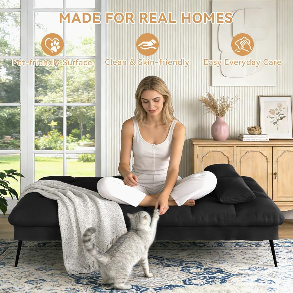 Black futon in bed position with a woman and a cat on top, showing casual home use