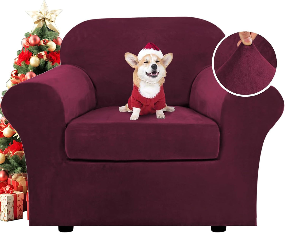 Front view of a single-seater covered in deep burgundy velvet slipcover with a small corgi wearing a Santa outfit seated on
