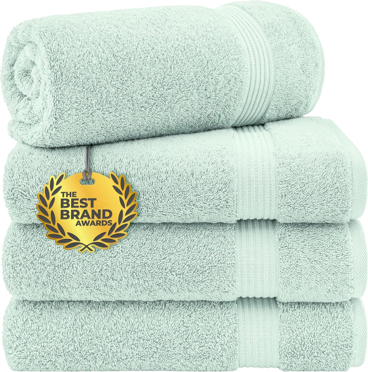 Stack of four rolled and folded light mint-green towels with a gold award tag on front