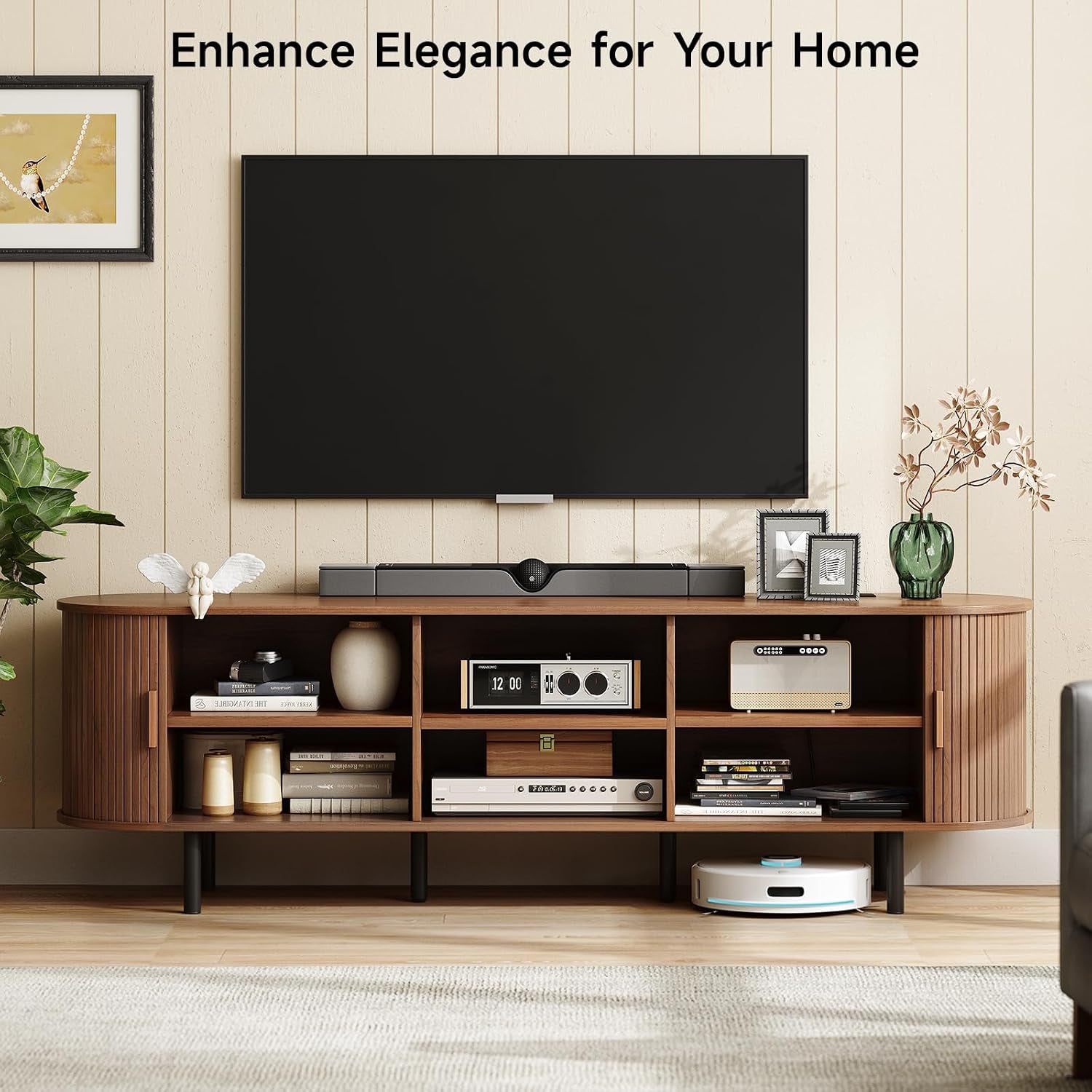 Walnut TV stand with sliding doors open revealing six storage compartments filled with electronics and decorative objects