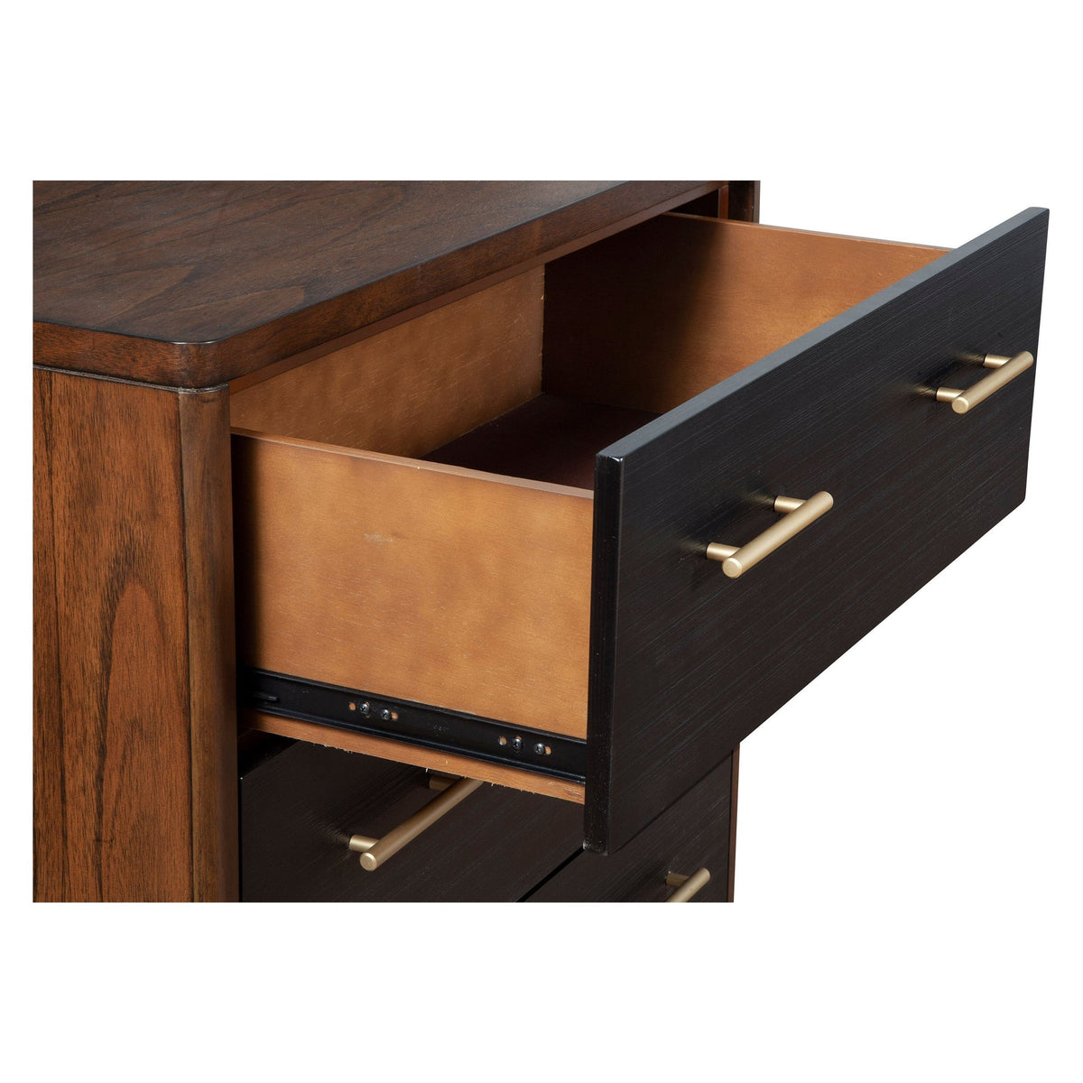 Close-up of an open chest drawer showing its interior, dark front, and gold-tone handles