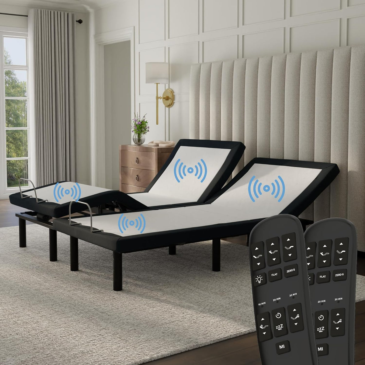 Split adjustable king base with head and foot raised, two wireless remotes in foreground