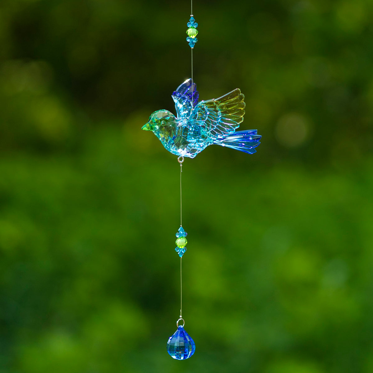 Blue and green acrylic bird ornament suspended with matching bead accents and a blue teardrop dangle.