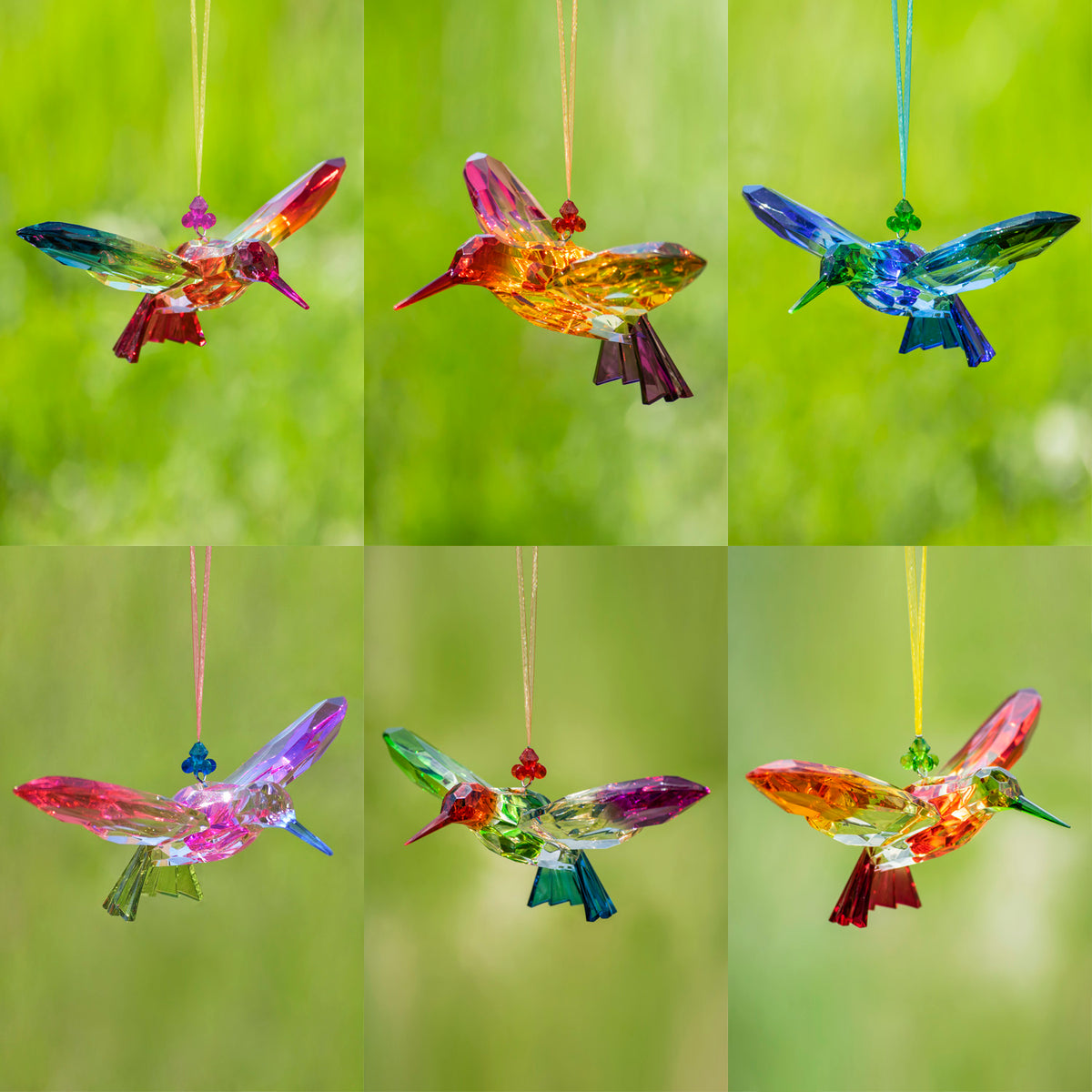 Six faceted hummingbird ornaments in assorted bright colors hanging against a soft green background.