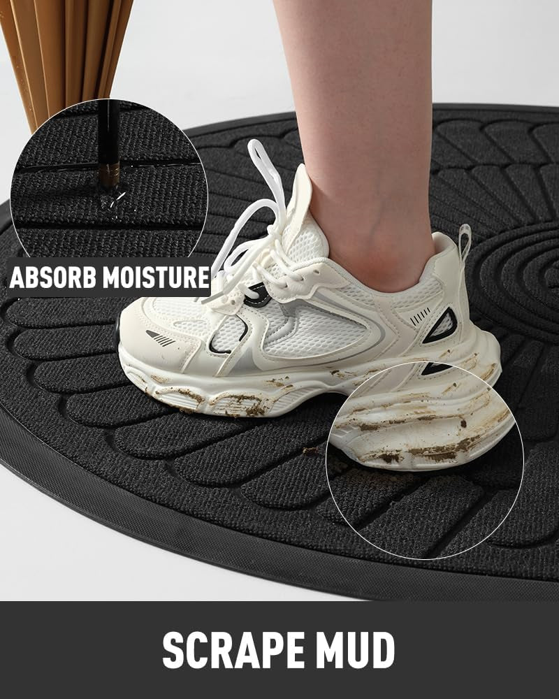 Black semicircular mat with a muddy white sneaker stepping on the ribbed surface highlighting mud scraping and moisture soak