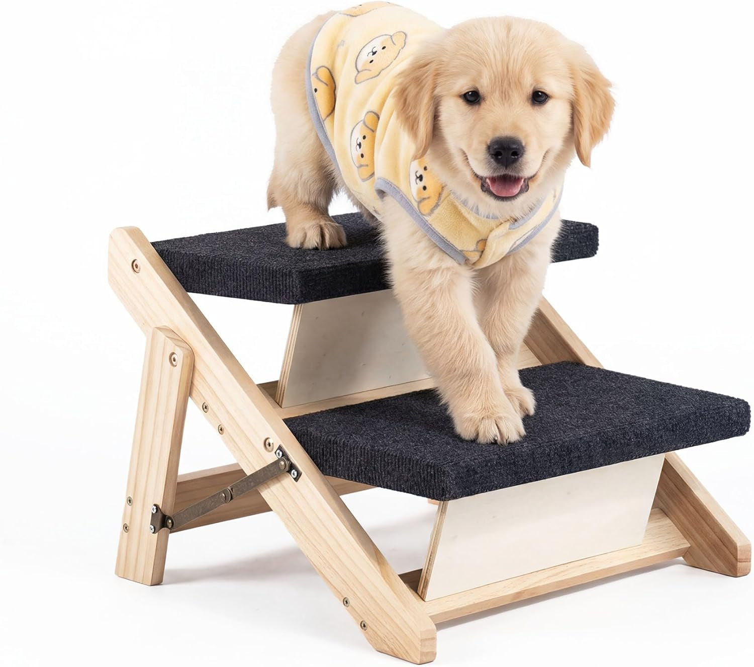 Front-angle close-up of a puppy in a yellow sweater standing on the top two steps with visible hinge and dark gray treads.