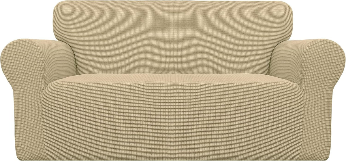 Front view of a beige two-seat loveseat fully covered in a textured stretch slipcover.