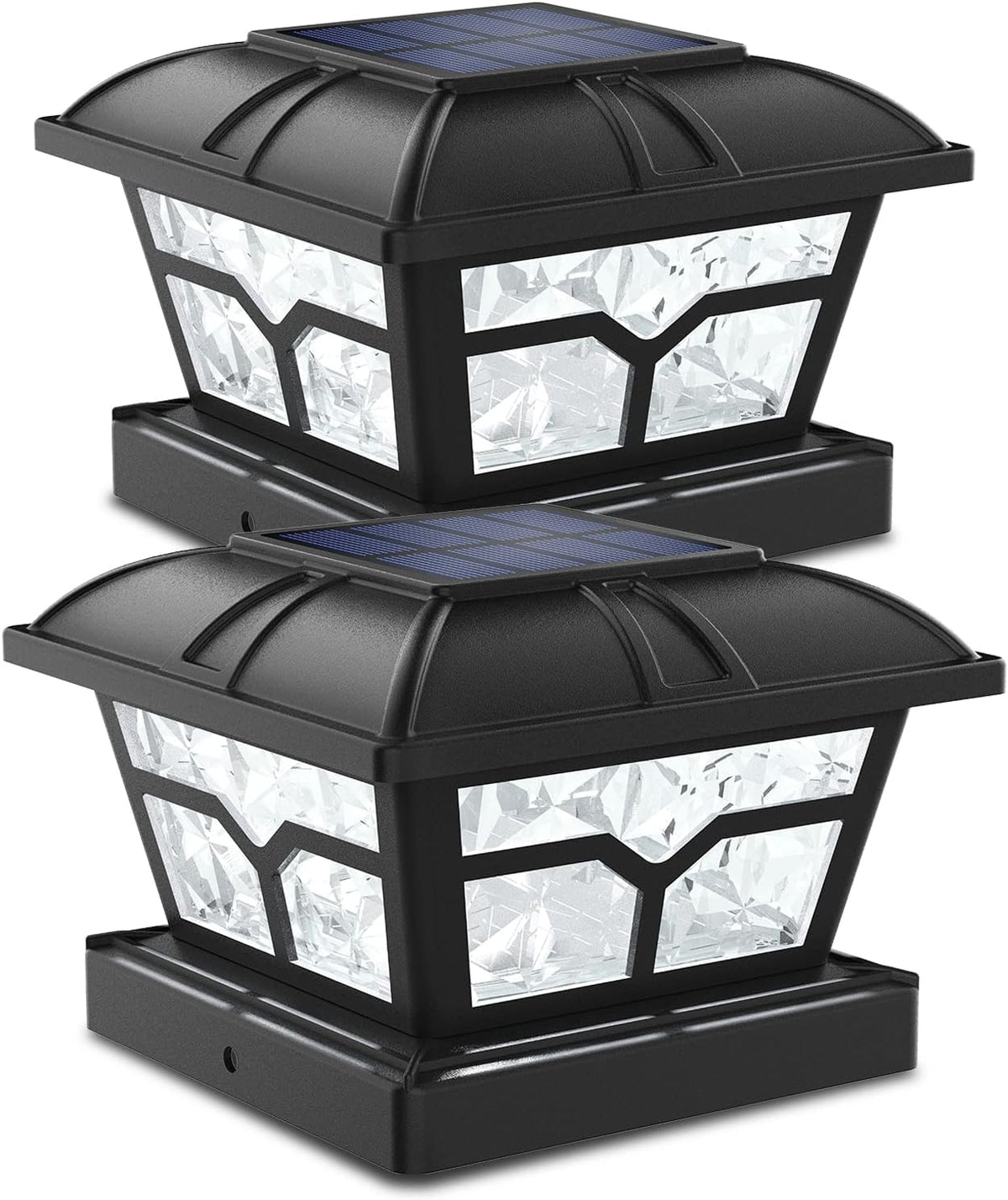 Two black post cap lights with faceted clear panels and solar panels on top.