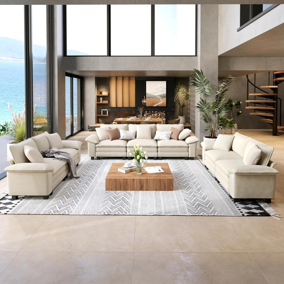 Bright two-piece sofa set in cream chenille arranged around a low wood coffee table in a tall, open living room.