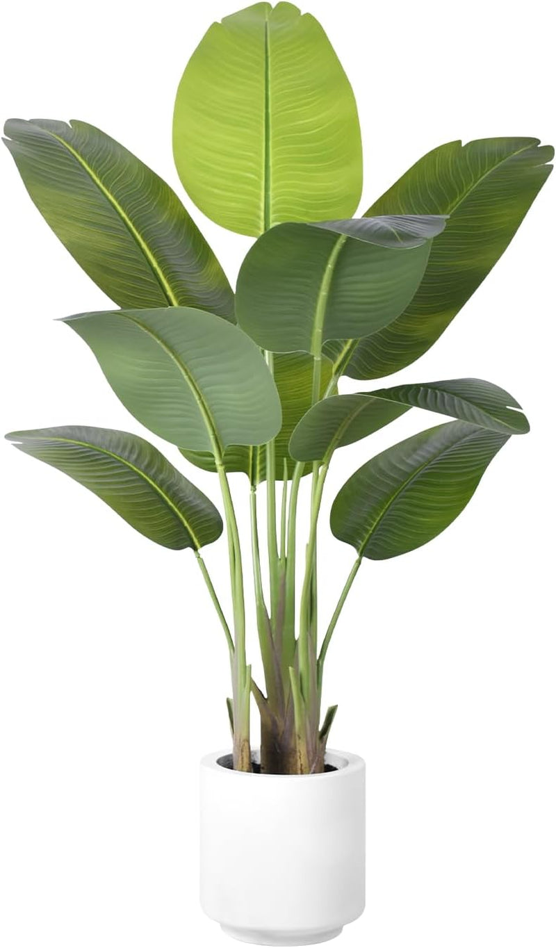 Bird of Paradise faux plant with green banana-style leaves in a white cylindrical pot, front-facing studio view