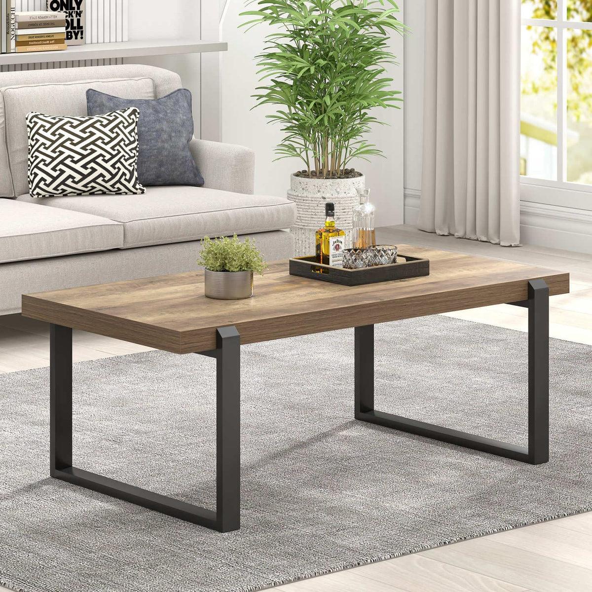 Rustic oak top coffee table with black metal legs, angled side view in a living room scene.