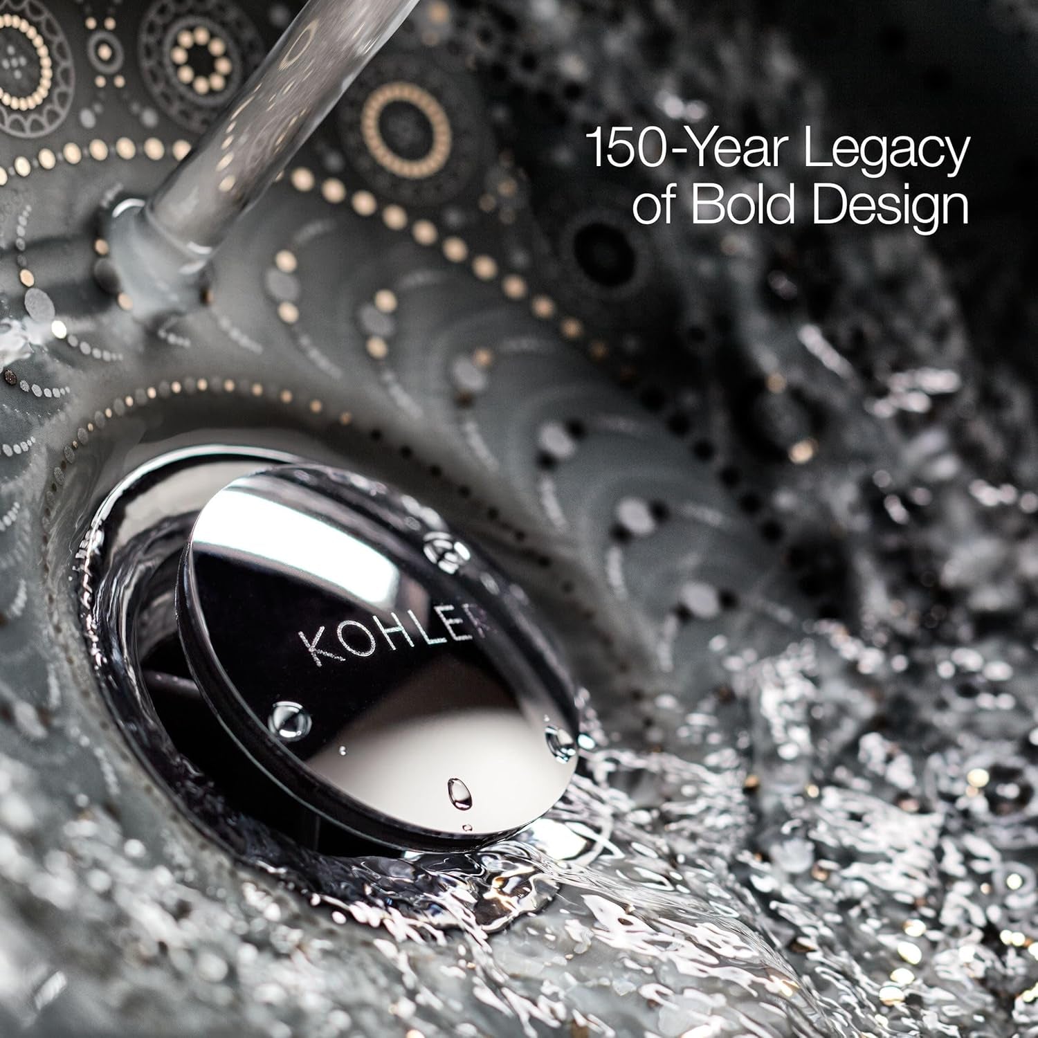 Close-up detail of a polished circular sink drain with flowing water and dotted decorative sink pattern.