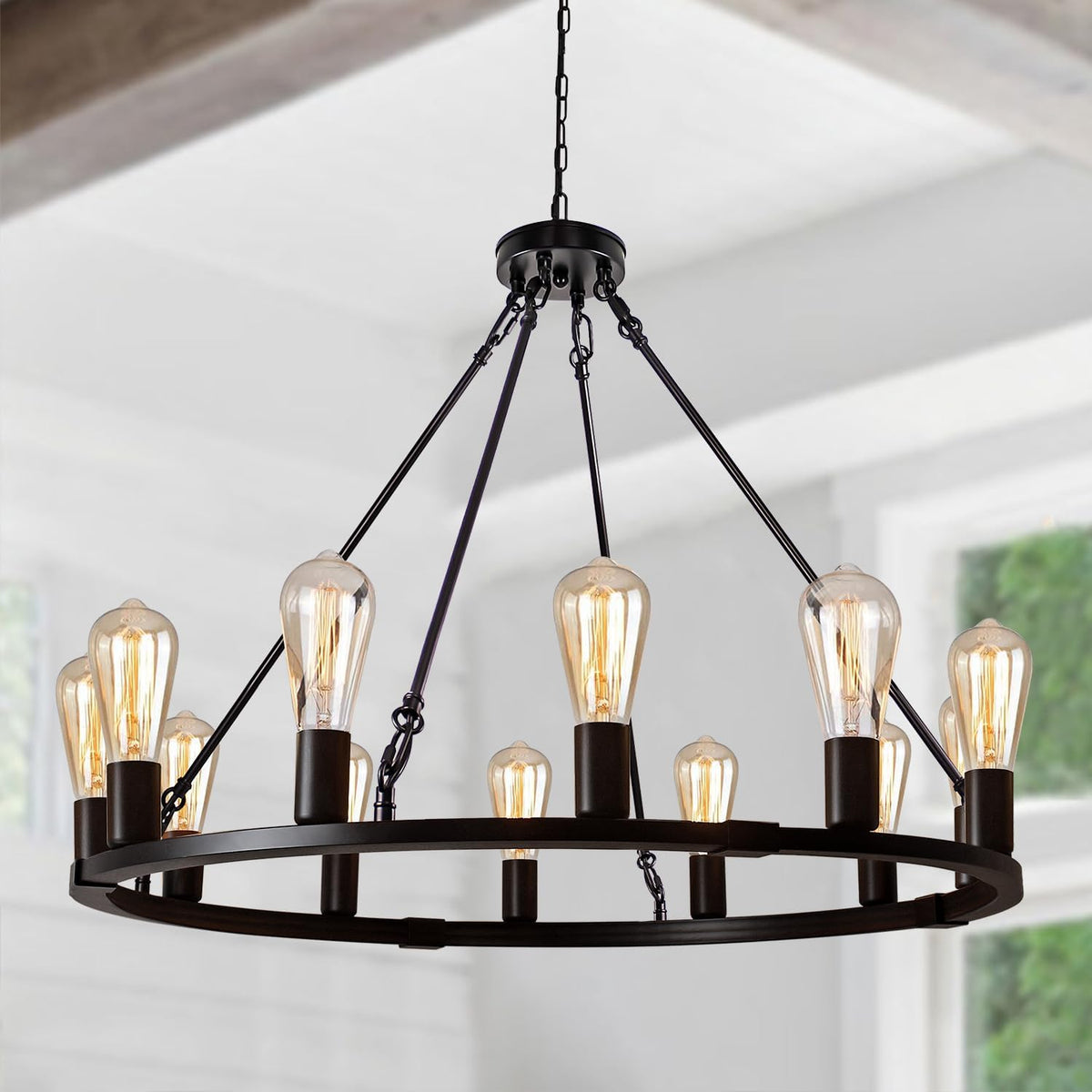 Tight crop of the chandelier's lit vintage-style bulbs and black metal sockets and chains