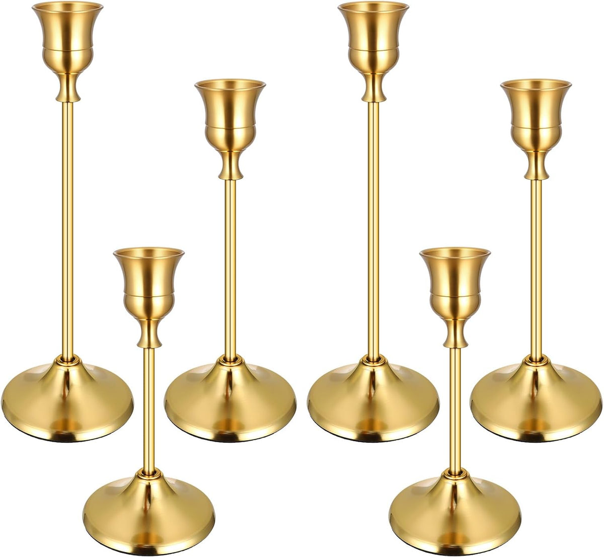 Six tall gold metal taper candlesticks grouped on white background, varying heights.