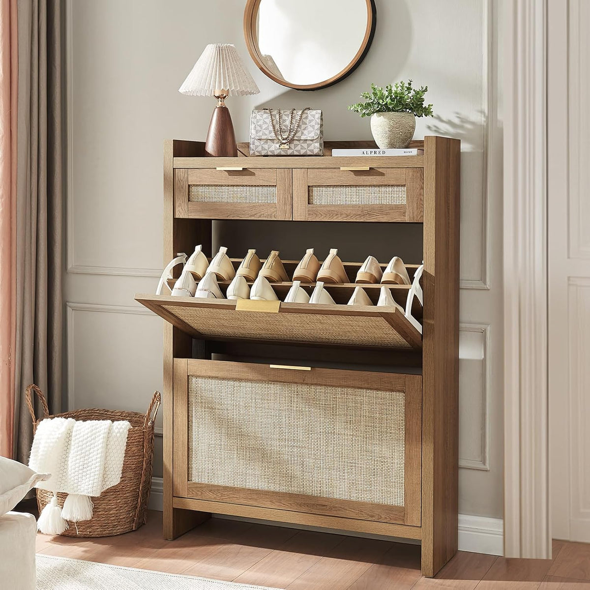 Rattan-front 2-flip shoe cabinet in rustic oak angled front view with decorative items on the top and the middle flip open