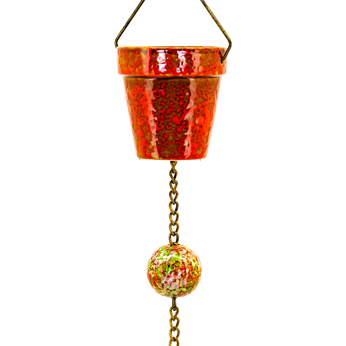 A red-orange painted bucket hangs from a chain with a multicolored spherical ornament below.