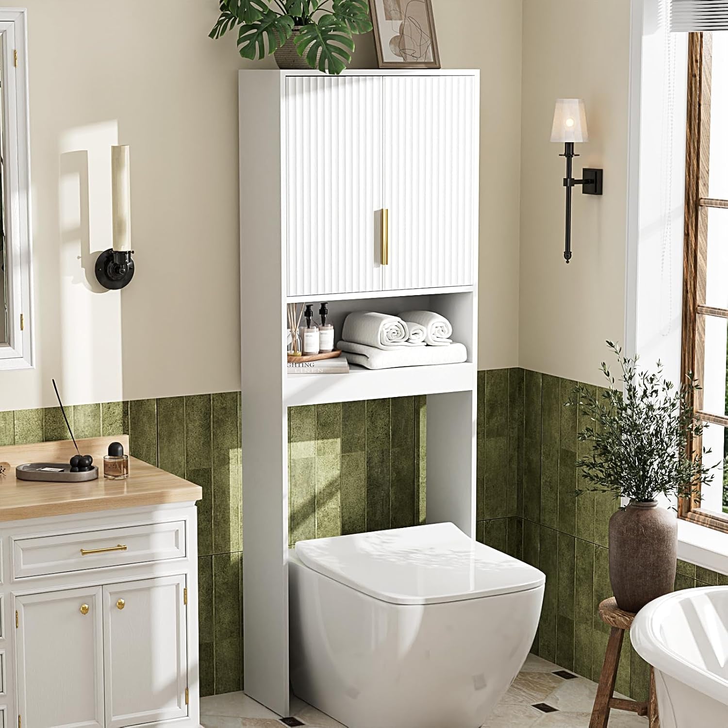Slim white over‑toilet storage cabinet with ribbed doors, open shelf and a single vertical support over a toilet.