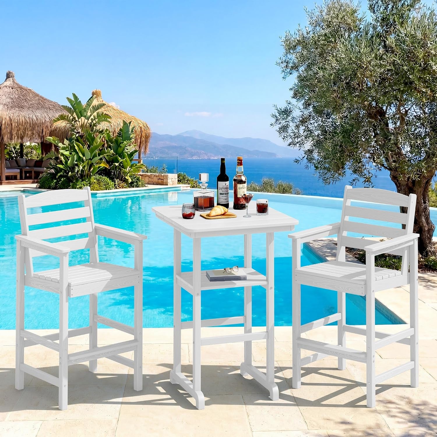 Bright poolside view with two white slatted bar chairs and a square white bar-height table.