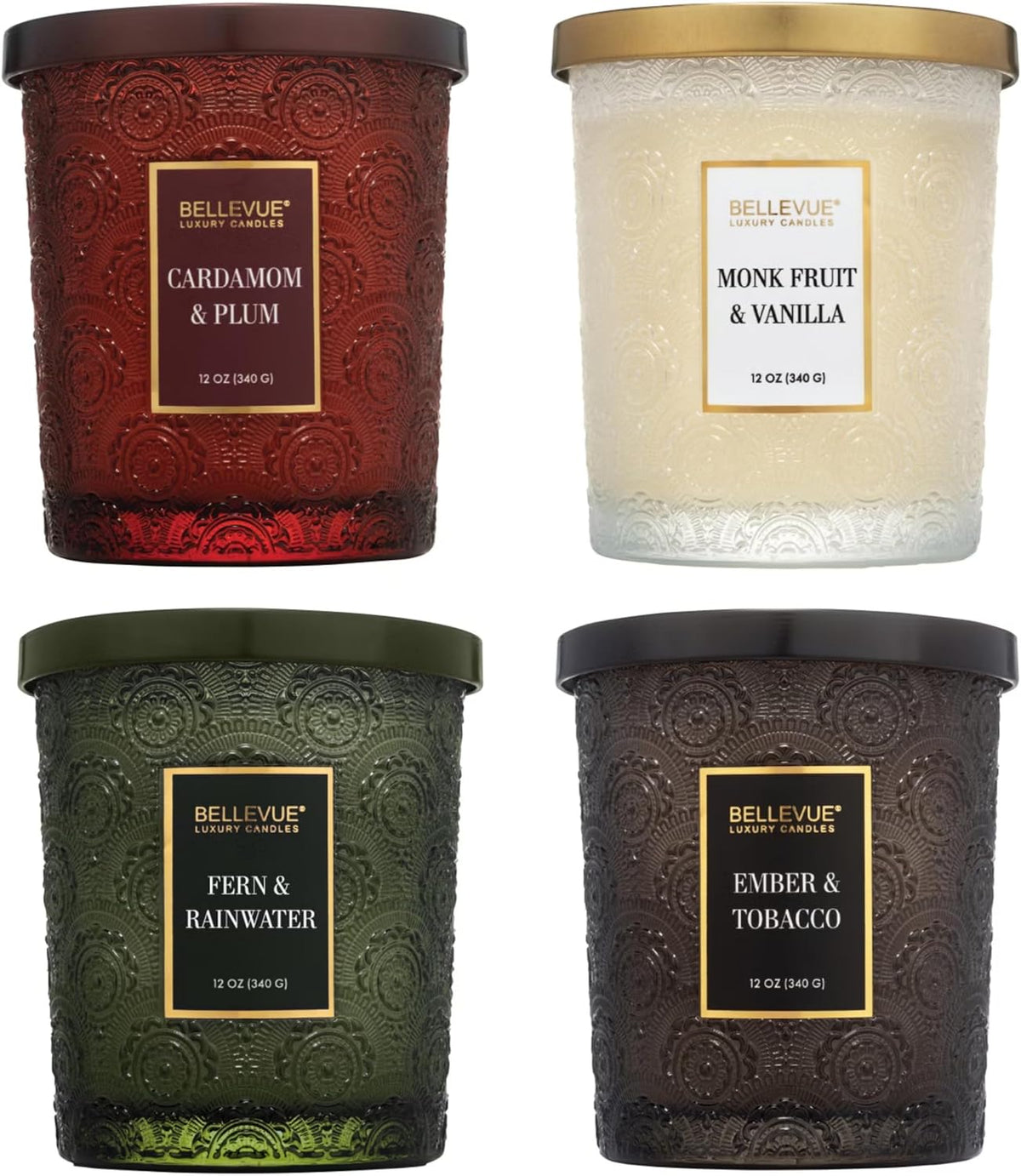 Close-up front view of four embossed glass jar candles showing red, white, green and dark brown jars with lids