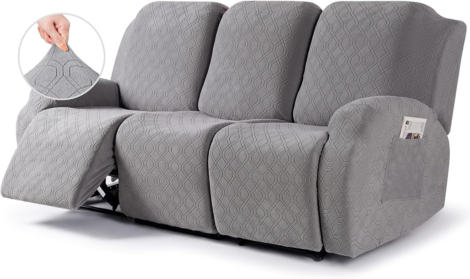 Three-seat reclining sofa in light gray textured slipcover with left footrest extended and circular inset showing fabric
