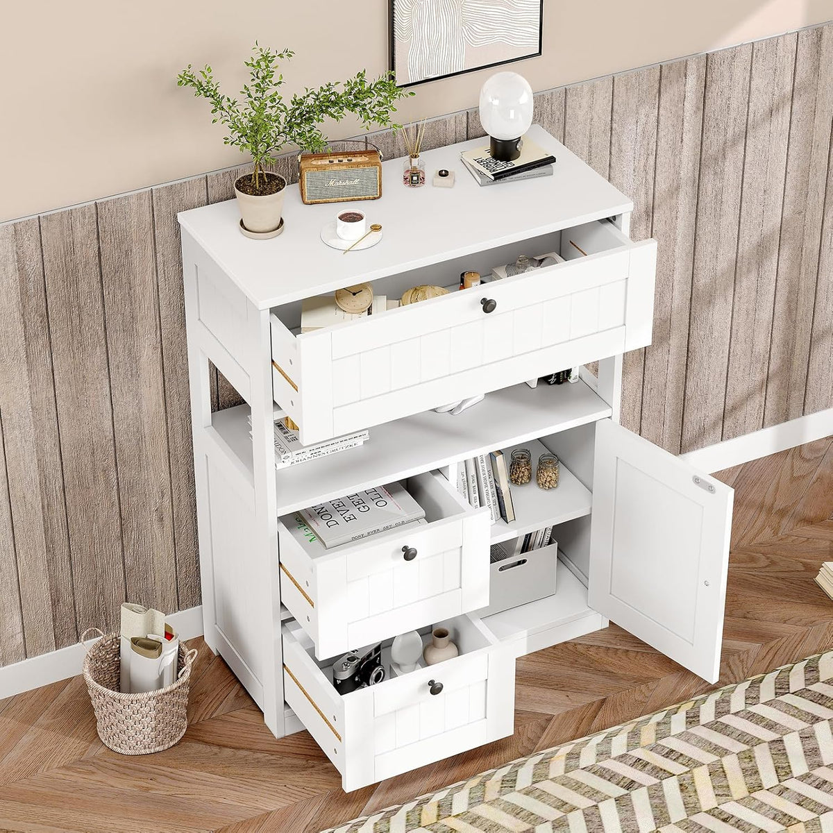 Top view of white beadboard cabinet with large top drawer open and middle open shelf visible