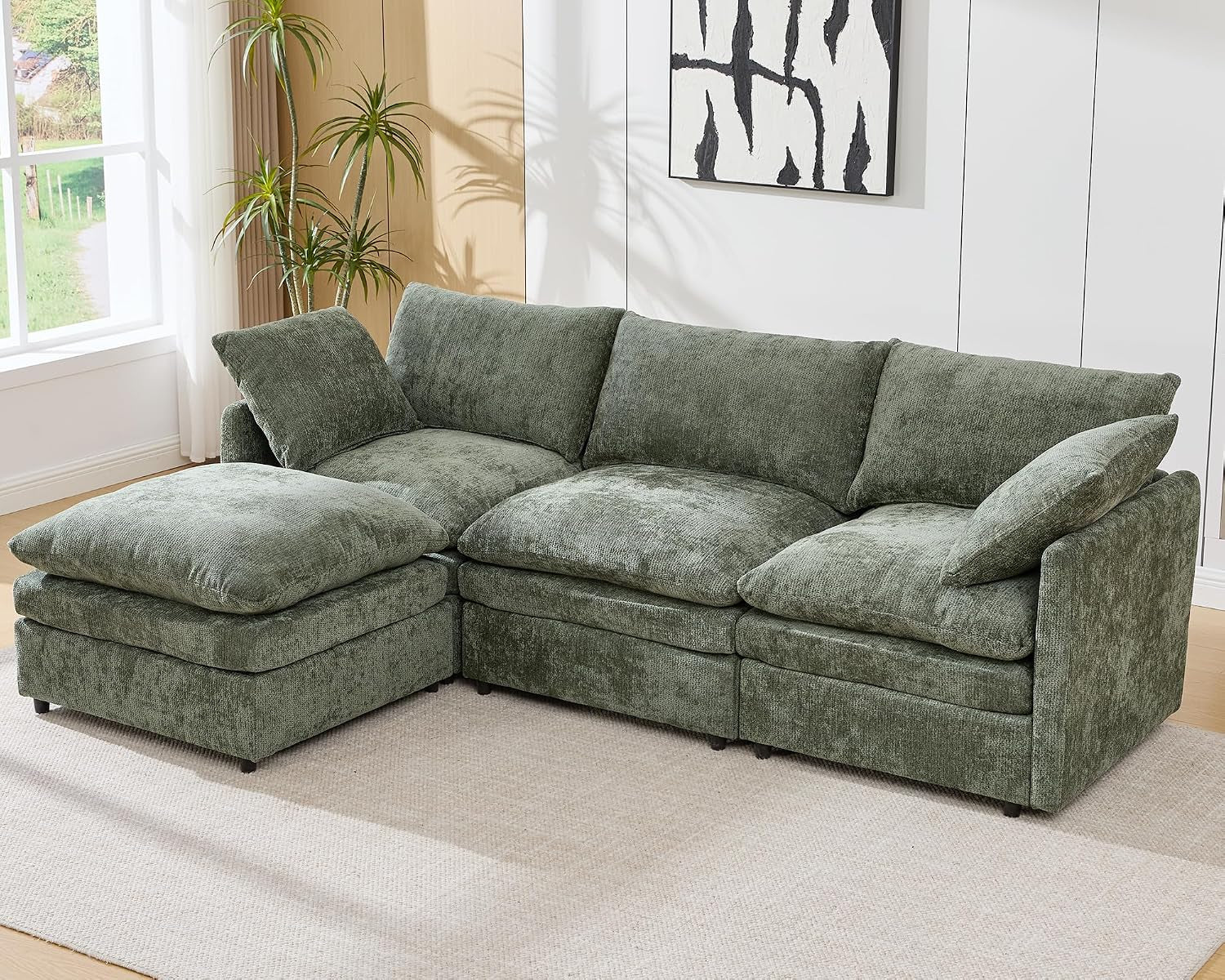Green three-seat L-shaped sectional with a left ottoman.