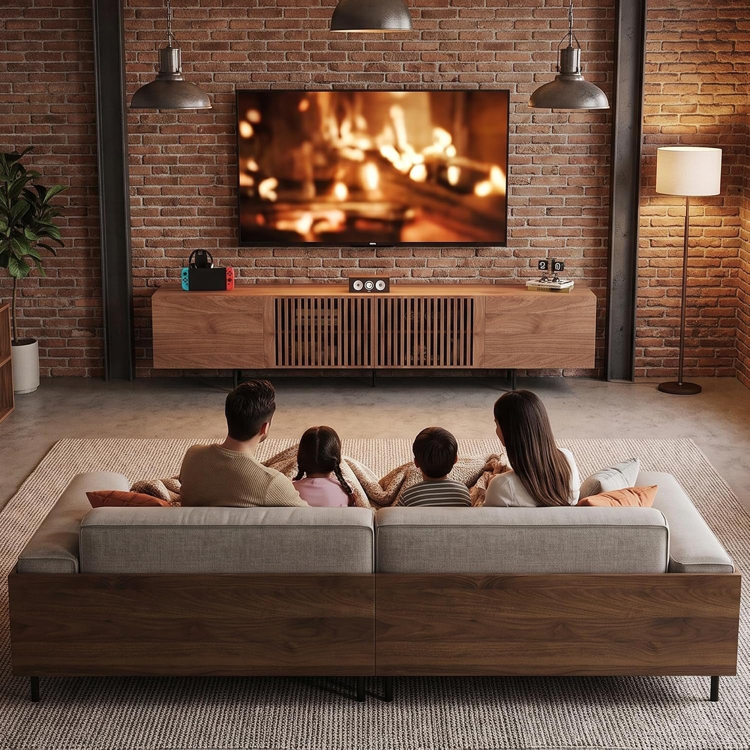 Family seated on a sofa facing a wall-mounted TV above a long brown slatted-door console.