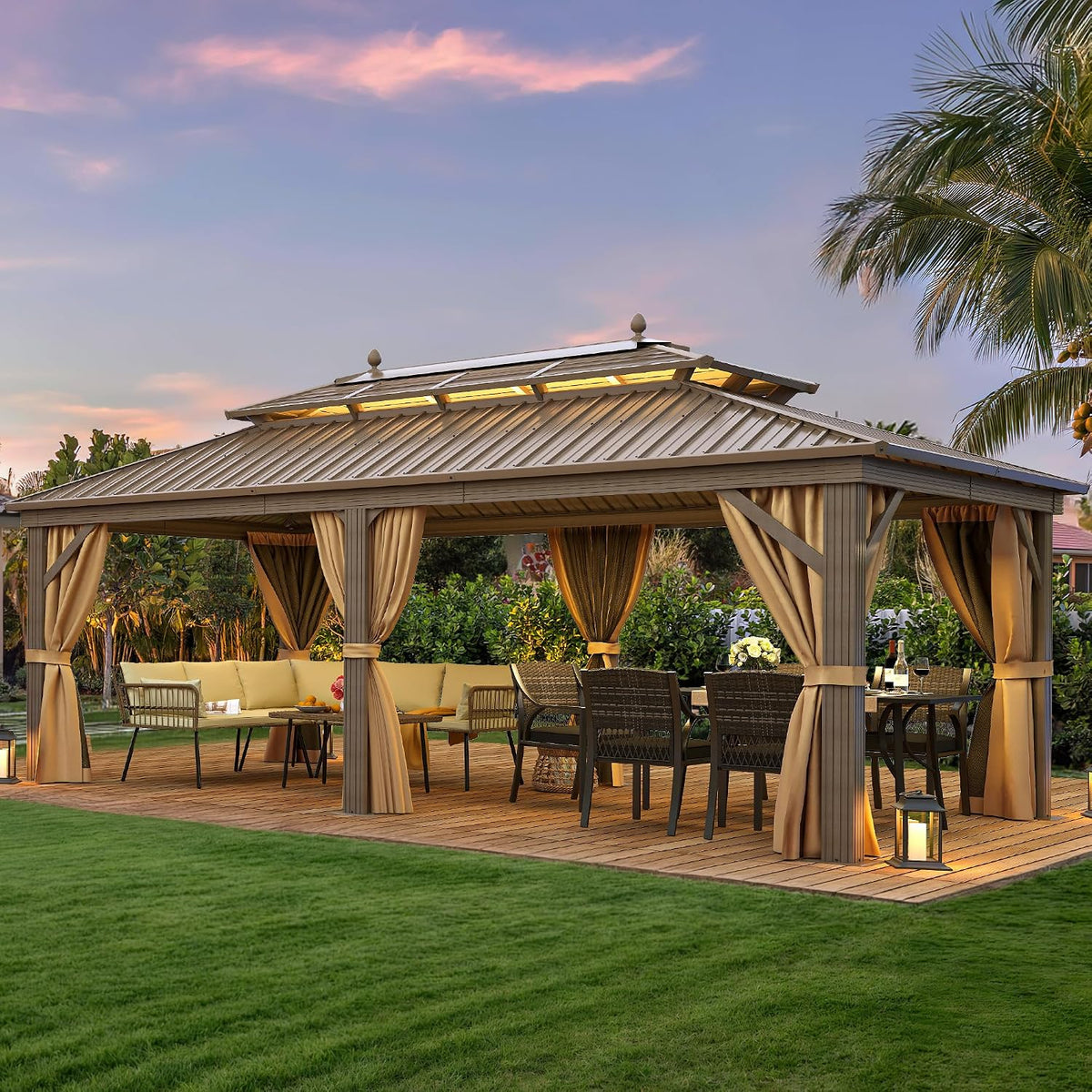 Beige-toned gazebo on a wooden deck set up as outdoor dining and lounge area at dusk
