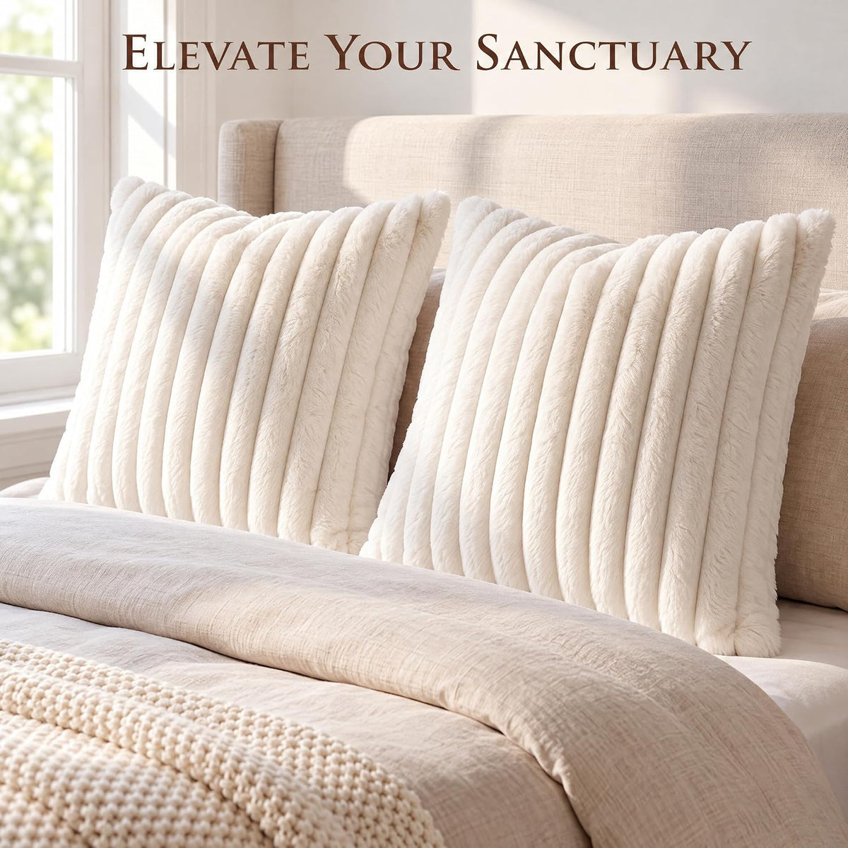 Two cream ribbed faux-fur pillows propped against a beige upholstered headboard on a bed