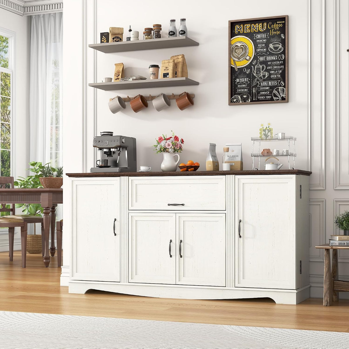 Close view of the white sideboard tabletop with espresso machine, vase of flowers and wall-mounted shelves and mug rack