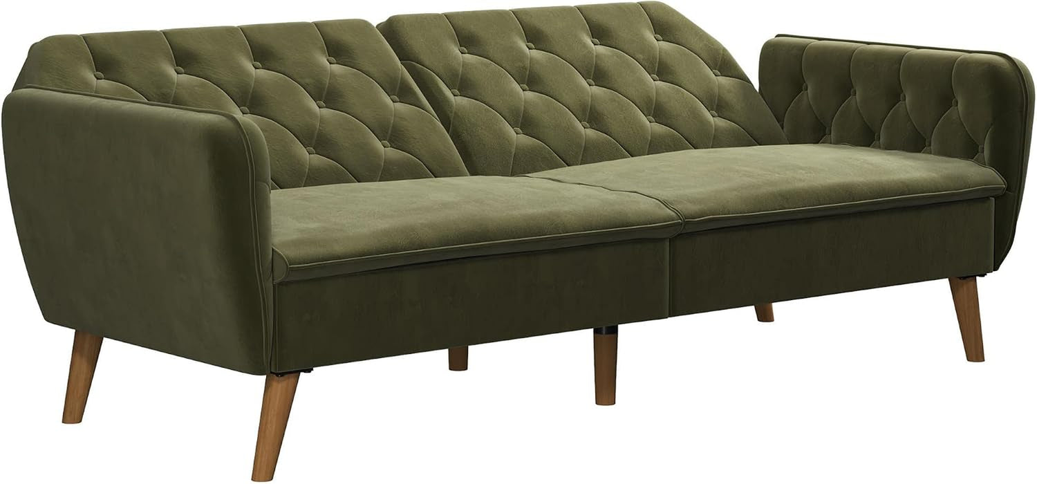Green velvet sofa position with tufted back and angled wooden legs visible
