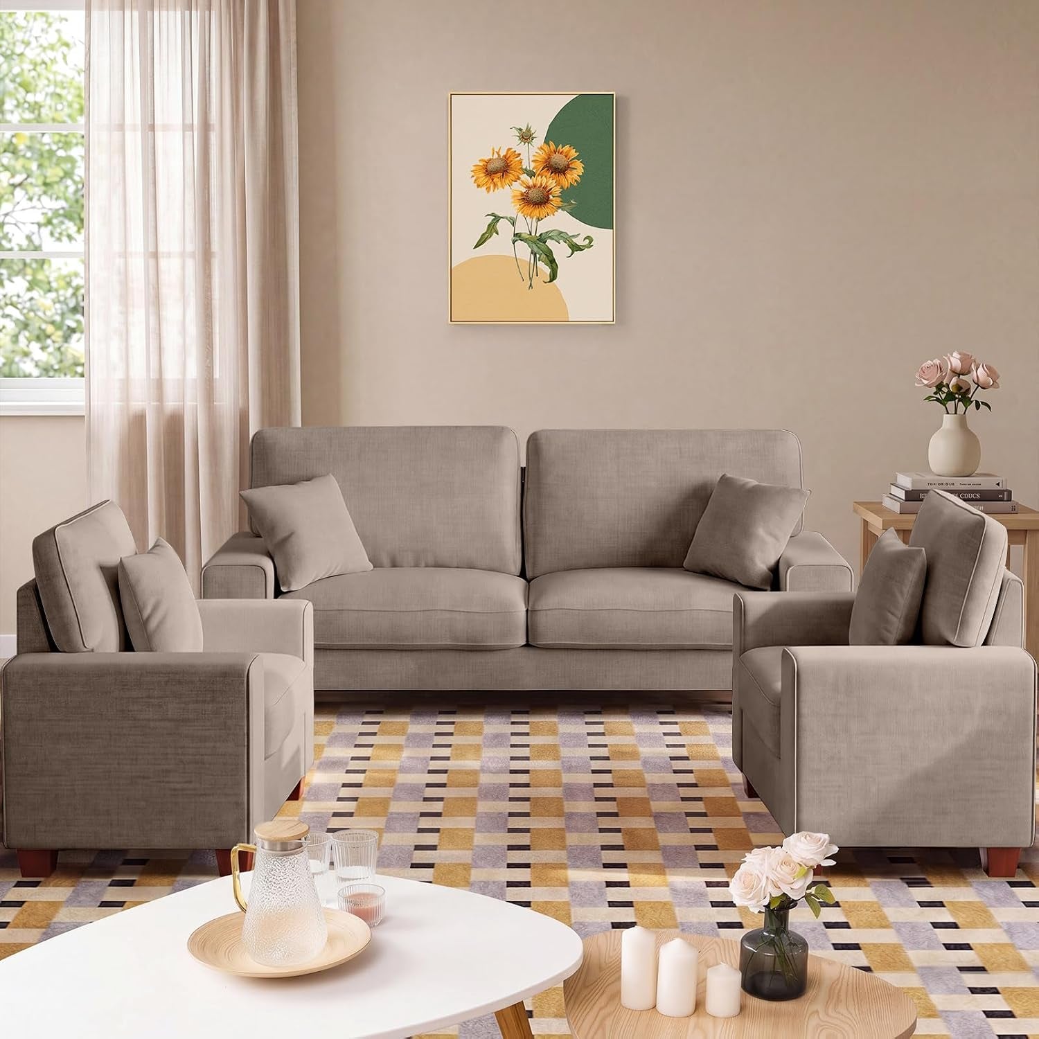 Beige loveseat and two matching armchairs in a living room with patterned rug and coffee table