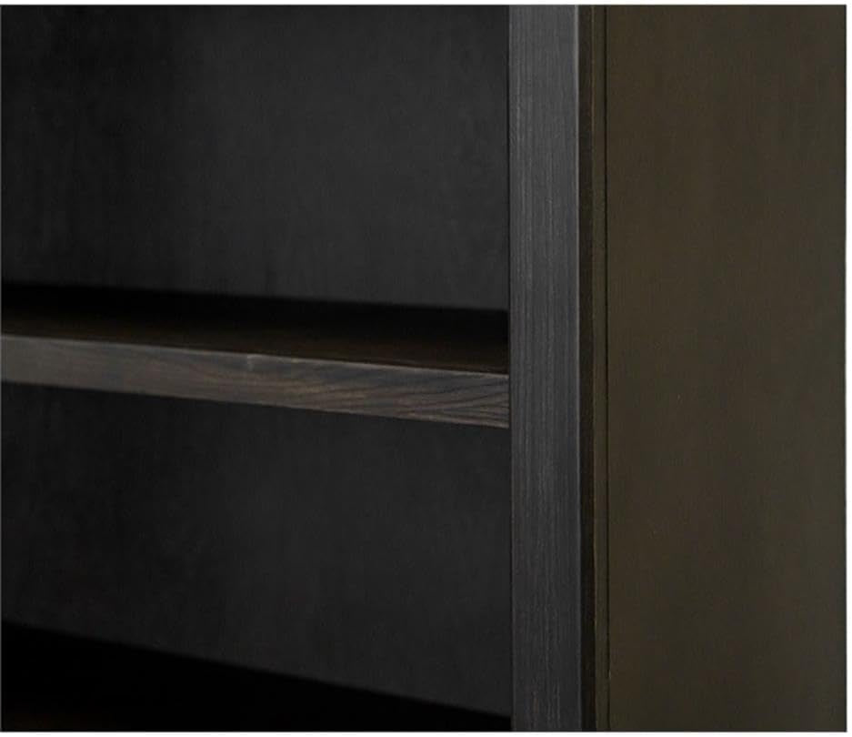 Tight view of an interior shelf edge and the vertical frame inside a dark brown bookcase.