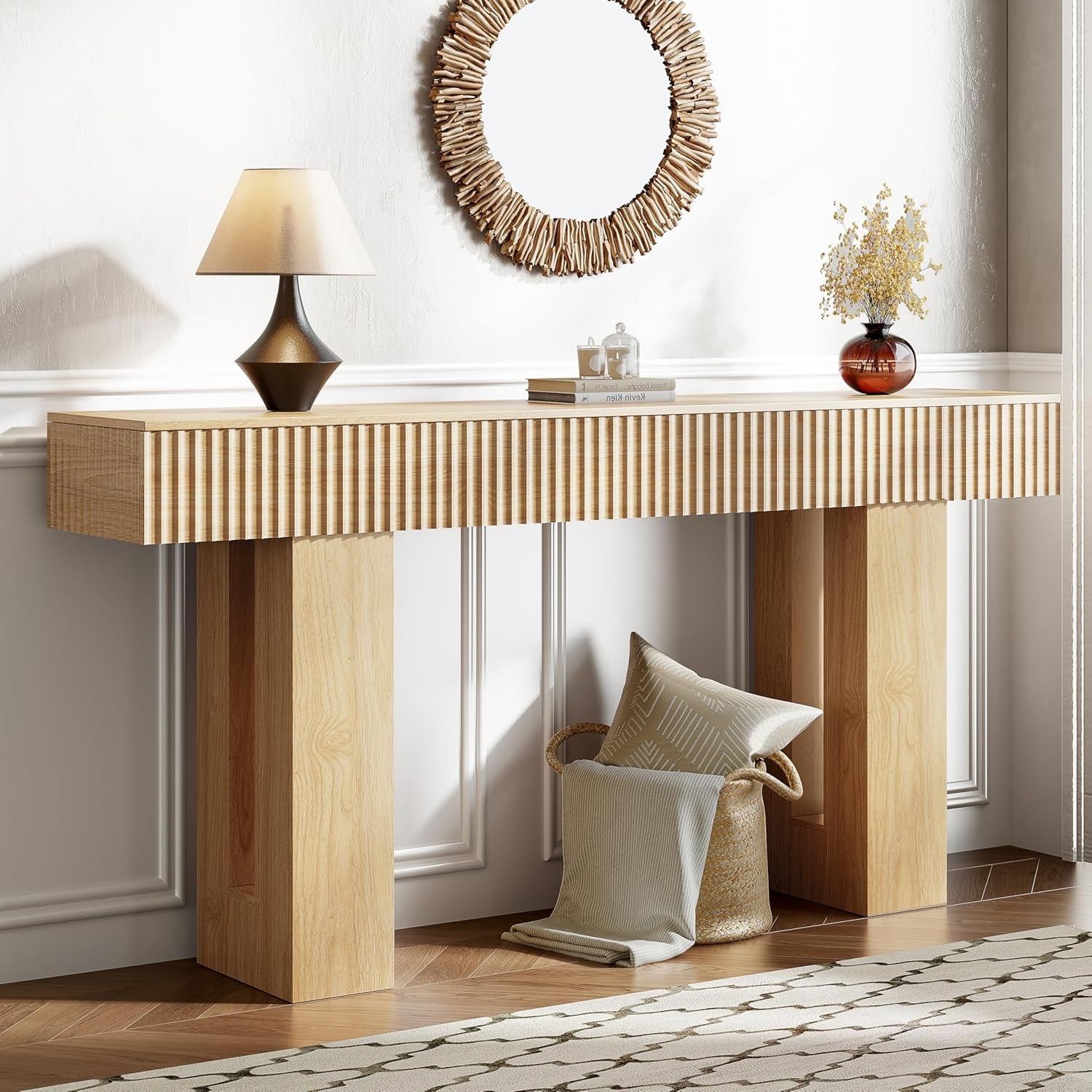 Natural oak fluted console table front view with lamp and round mirror in a foyer setting