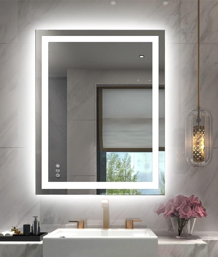 Vertical illuminated mirror with inner and outer LED borders above a single sink and pendant light.