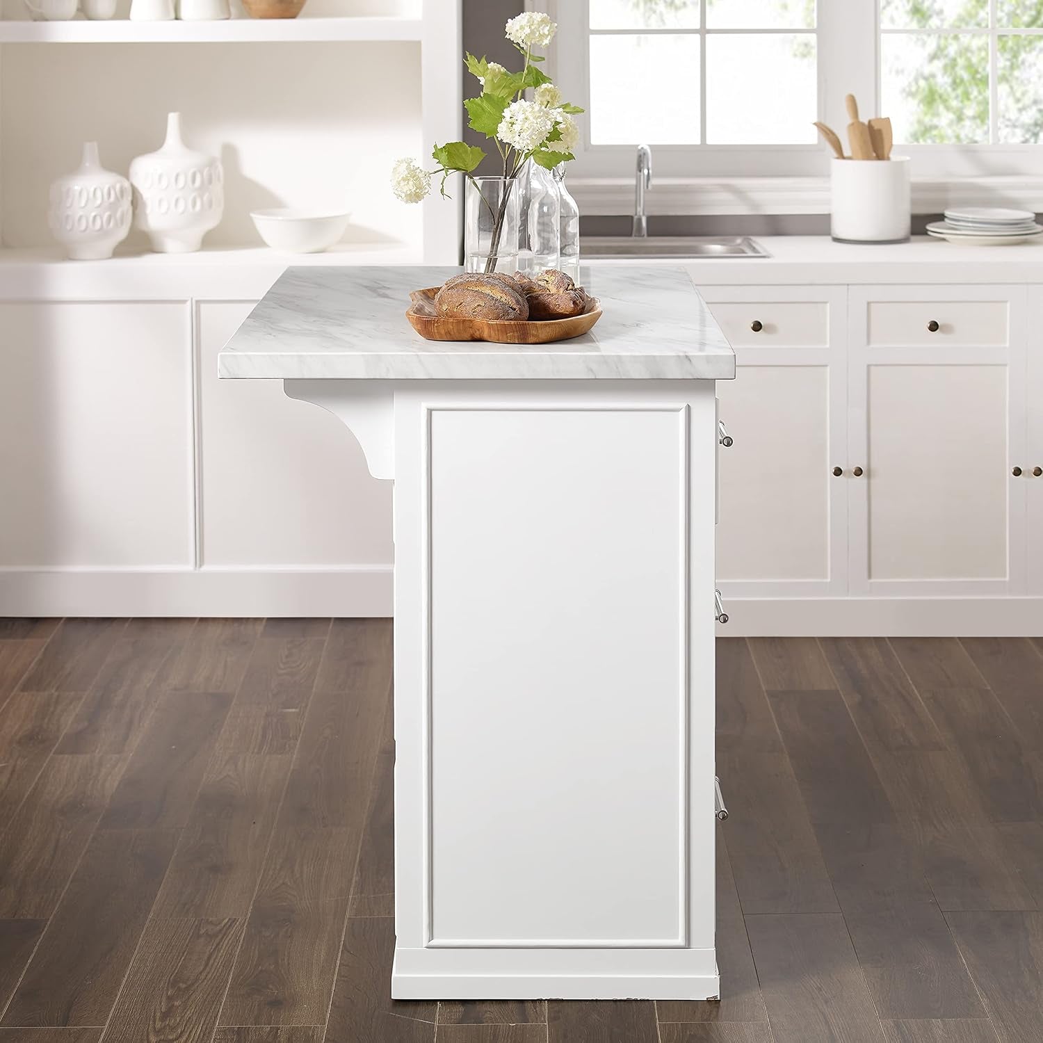 Side profile highlighting the slim countertop overhang, framed side panel and sunlight from the window