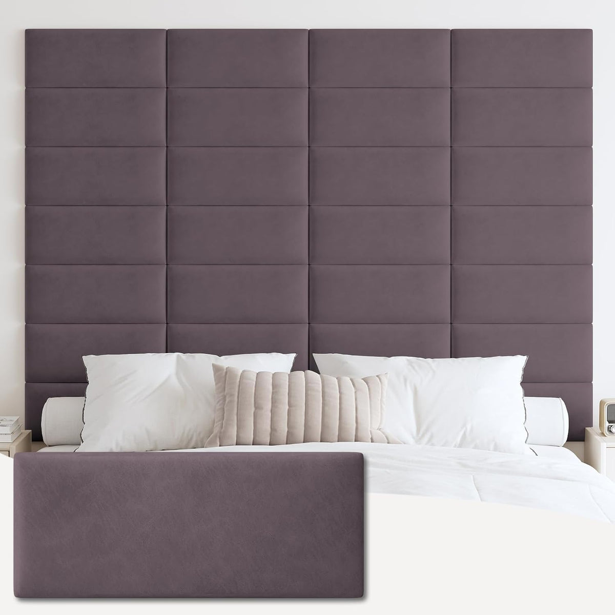 Tall grid of tufted rectangular panels in a muted medium-gray behind a bed with white pillows and a beige lumbar pillow.